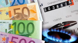 euro cash, gas flame and electric meter as symbol for expensive energy costs