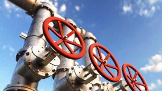 Industrial oil pipeline at a modern refinery with large red valves for cutting supply 3d render